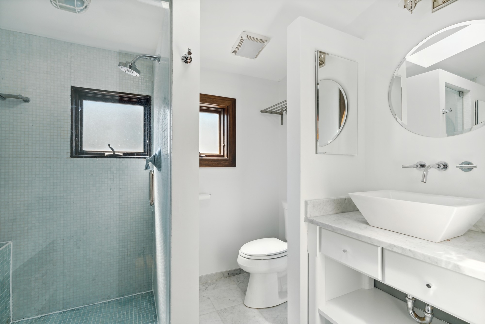 3317 North Bell Avenue Chicago, IL 60618 - Photo 19 of 30 a bathroom with a toilet sink and mirror