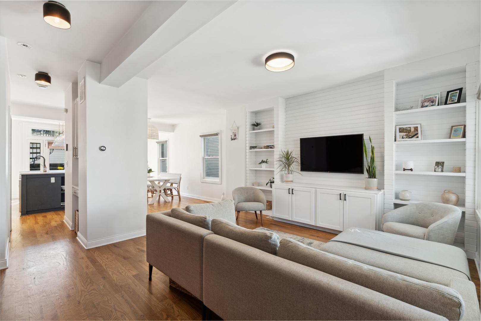 3317 North Bell Avenue Chicago, IL 60618 - Photo 4 of 30 a living room with furniture and a flat screen tv