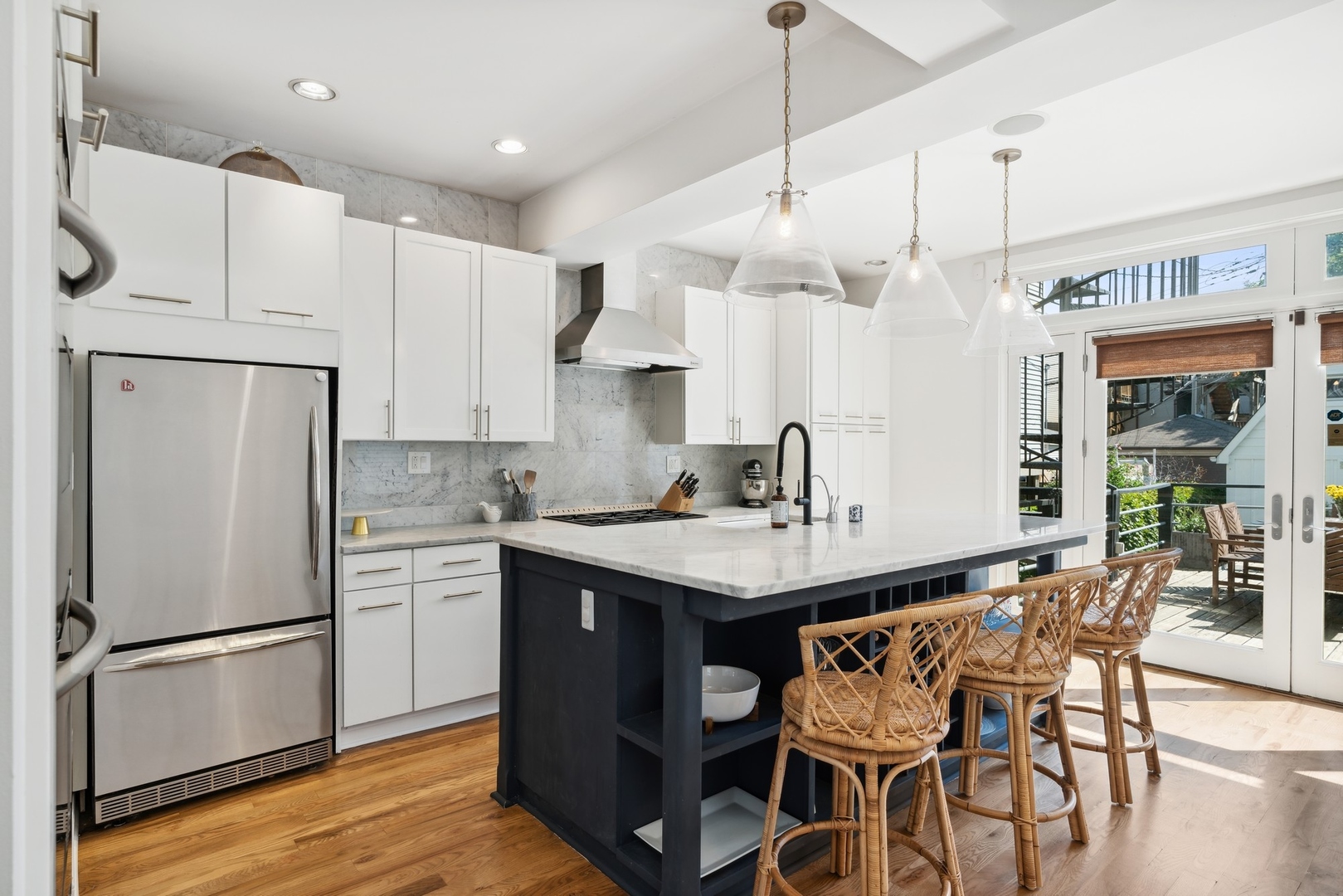 3317 North Bell Avenue Chicago, IL 60618 - Photo 6 of 30 a kitchen with stainless steel appliances granite countertop a refrigerator a sink dishwasher a stove and a refrigerator with wooden floor