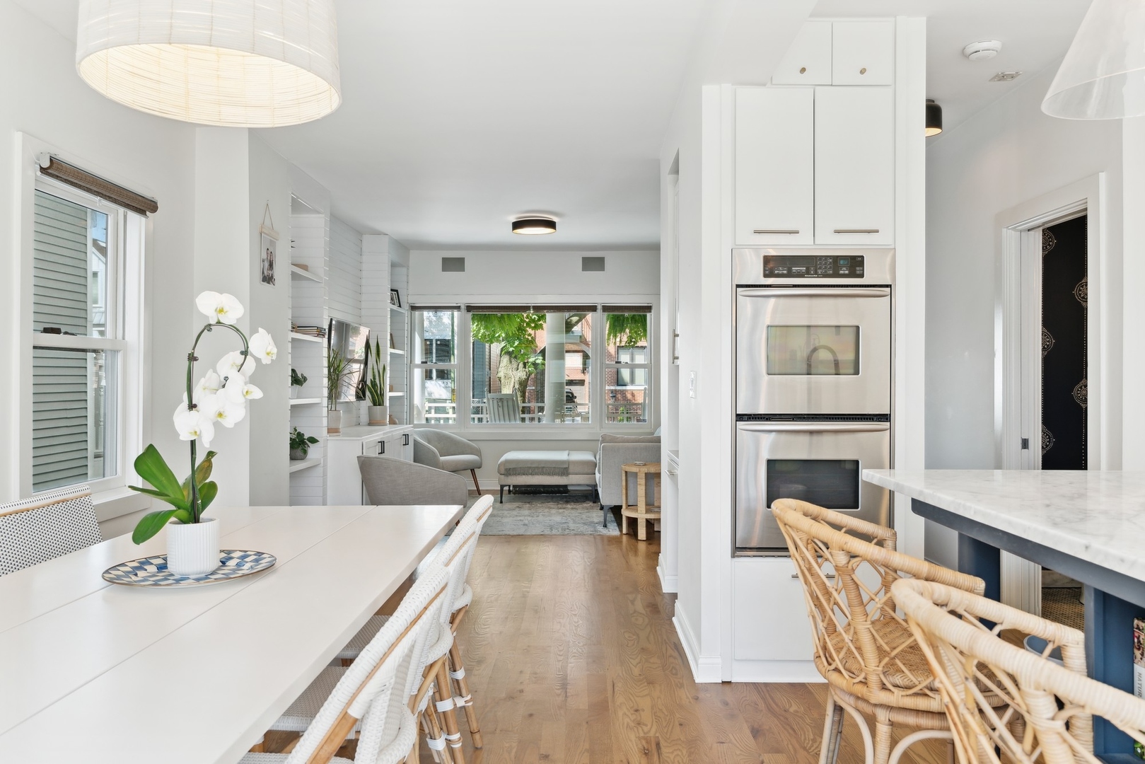 3317 North Bell Avenue Chicago, IL 60618 - Photo 9 of 30 a dining room with furniture and a kitchen view