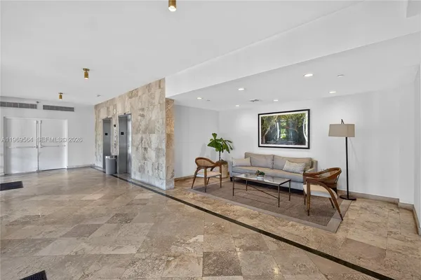 a living room with furniture and a table