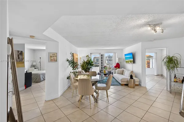 a living room with furniture and a table