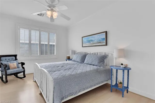 a bed room with a bed and a chandelier