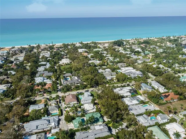 an aerial view of a houses with city view