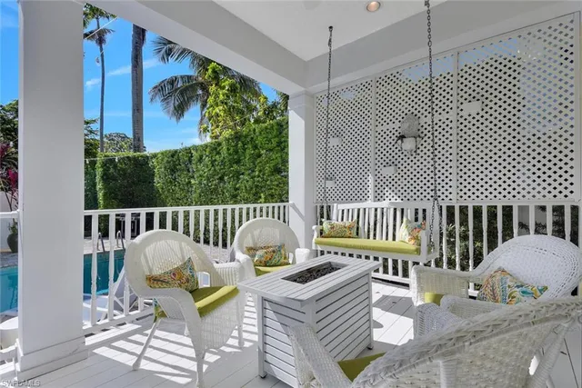 a view of a balcony with wooden floor