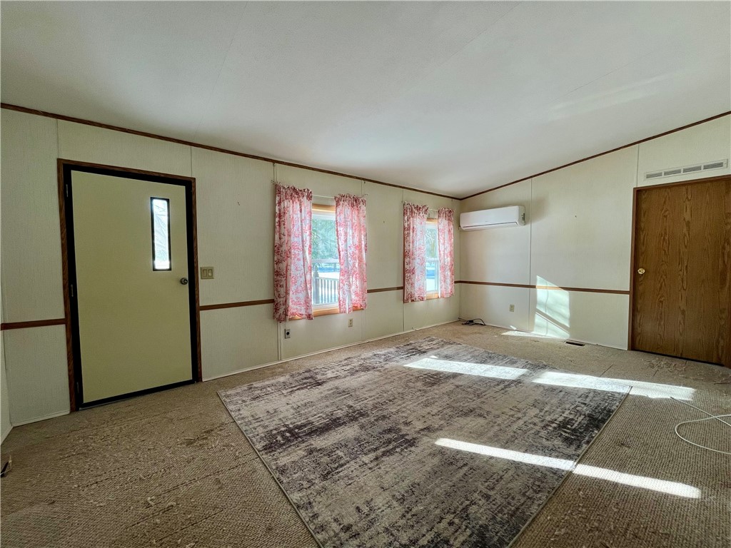 9207 Wayne Center Road Rose, NY 14489 - Photo 17 of 24 Living room with mini-split for cooling