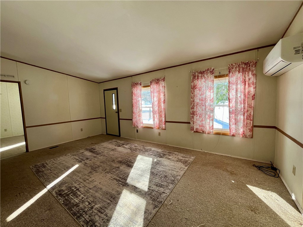 9207 Wayne Center Road Rose, NY 14489 - Photo 18 of 24 Living room with mini-split for cooling