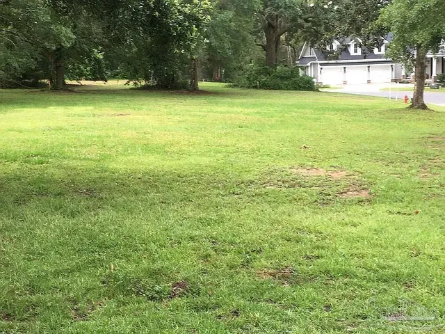 a view of a swimming pool with an outdoor space and seating area