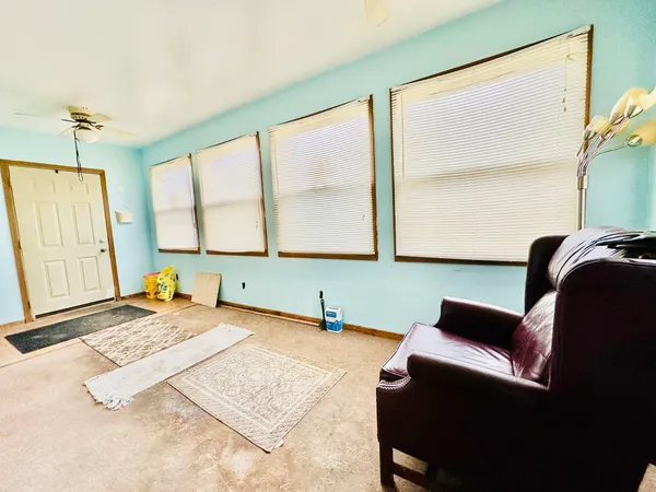 a bedroom with furniture and a window