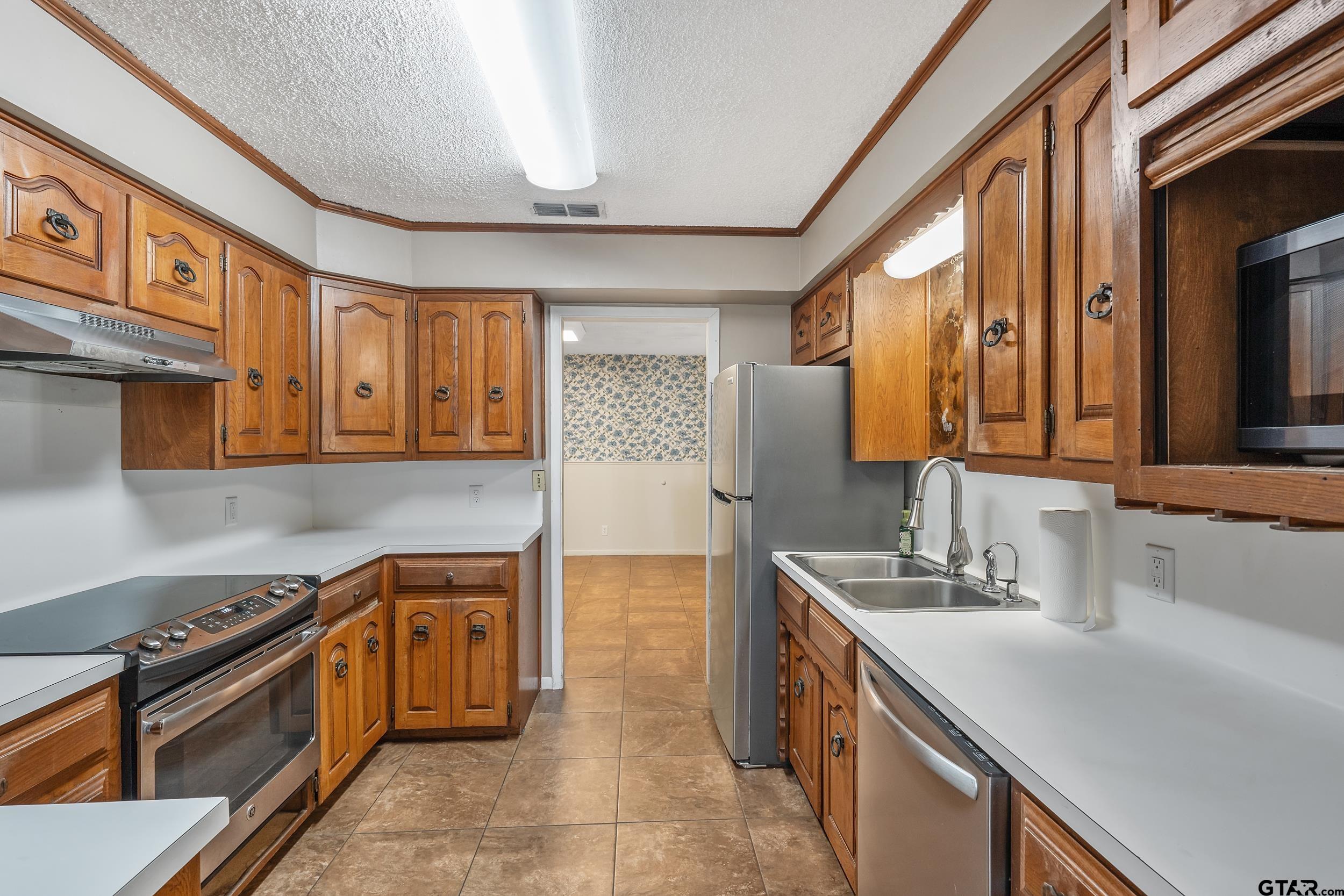 150 Rodney Hawkins, TX 75765 - Photo 13 of 36 a kitchen that has a sink and a stove