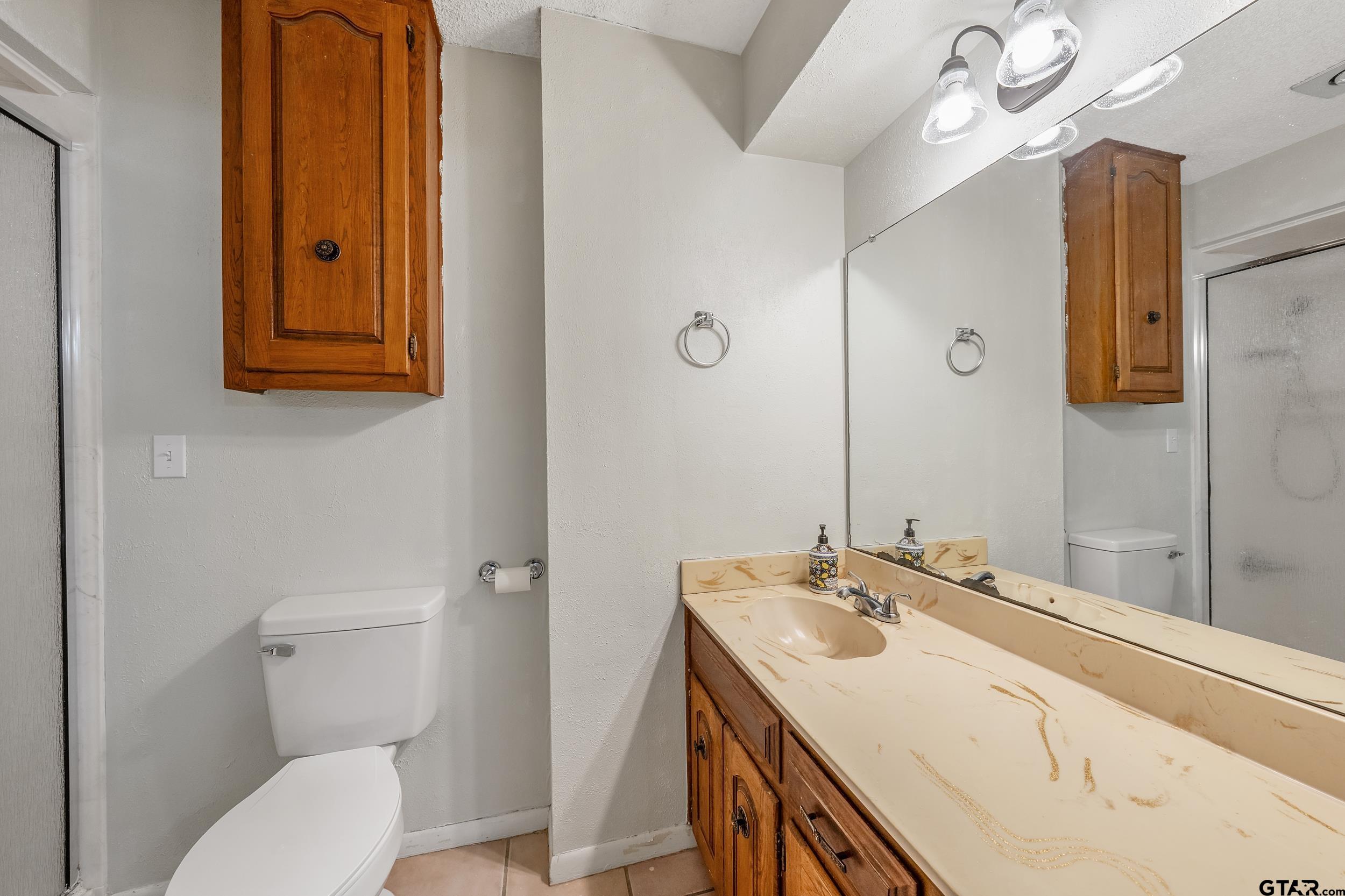 150 Rodney Hawkins, TX 75765 - Photo 25 of 36 a bathroom with a sink a toilet and mirror