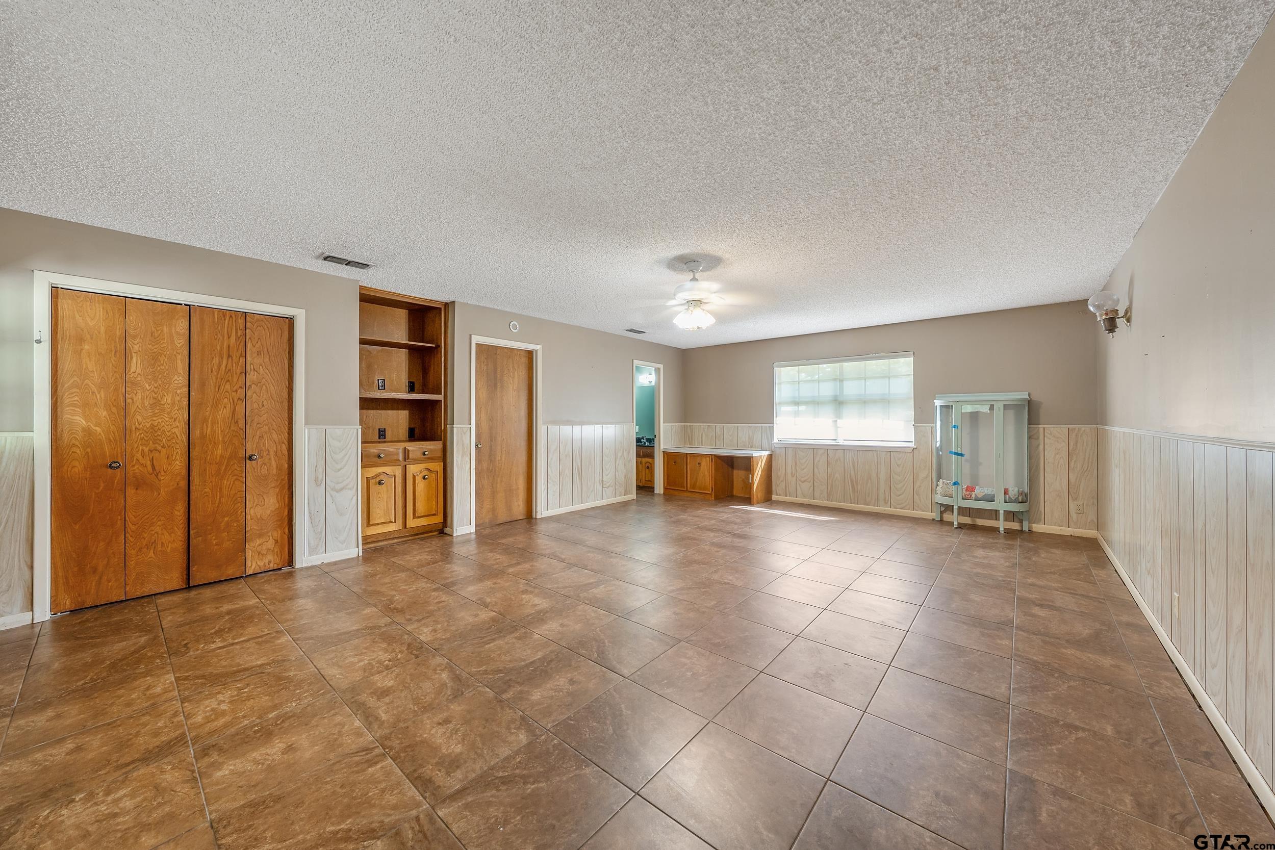 150 Rodney Hawkins, TX 75765 - Photo 27 of 36 a view of empty room with wooden floor and cabinet