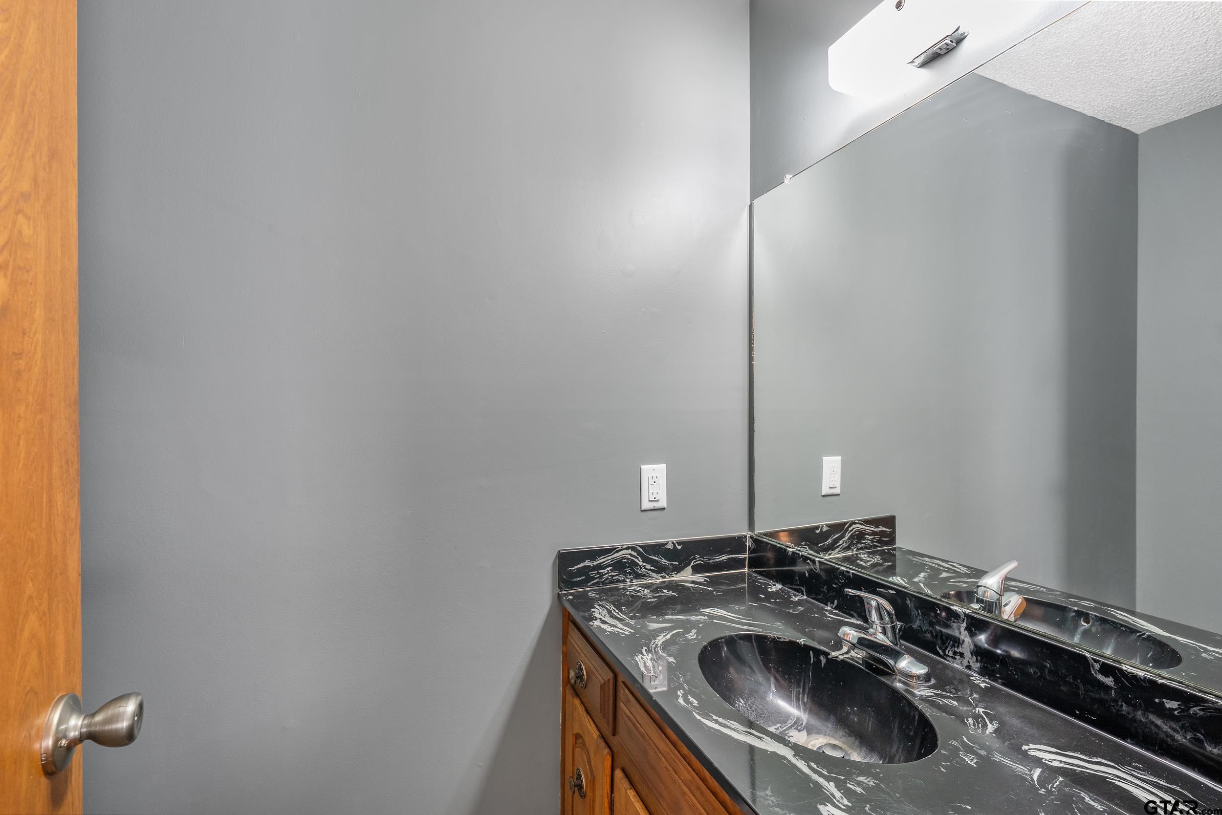 150 Rodney Hawkins, TX 75765 - Photo 28 of 36 a bathroom with a sink and a vanity