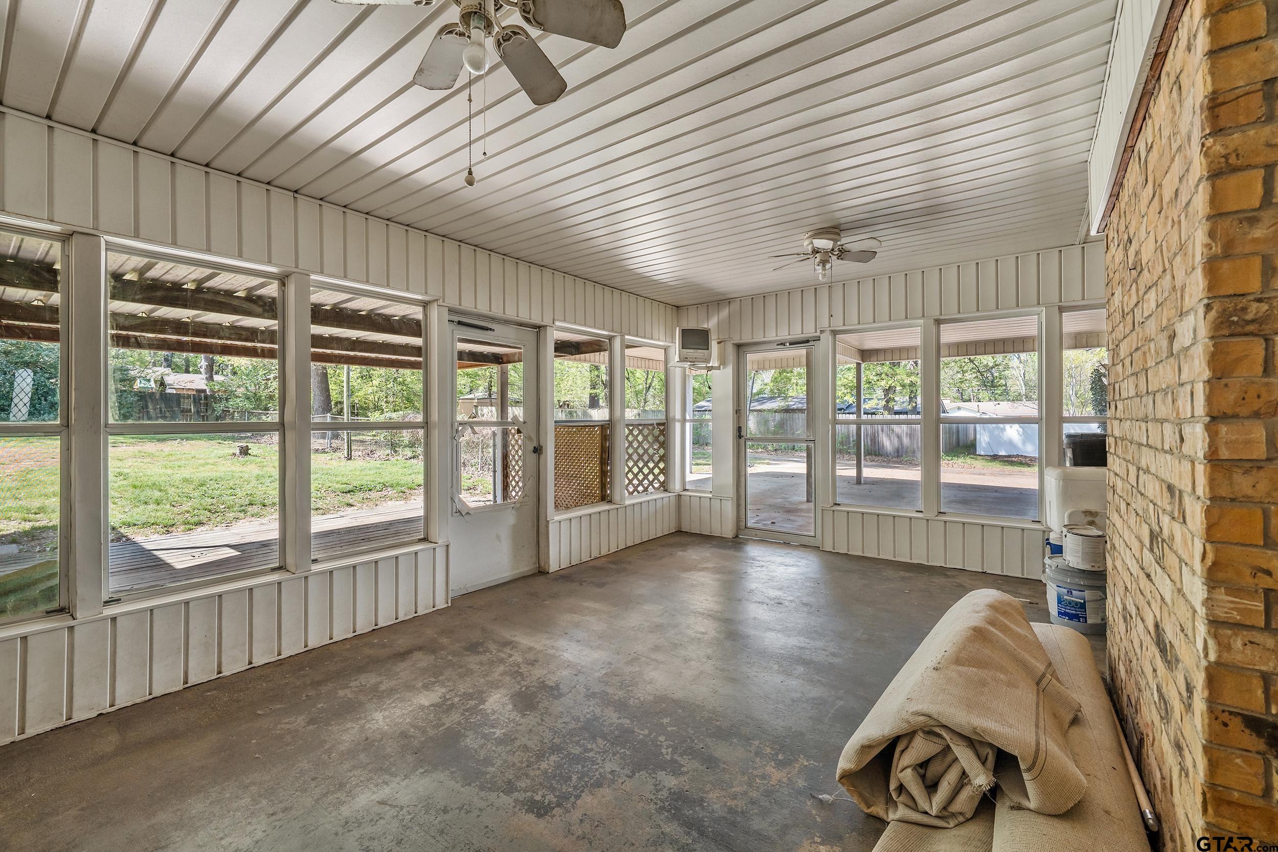 150 Rodney Hawkins, TX 75765 - Photo 30 of 36 a view of an empty room with wooden floor and a window