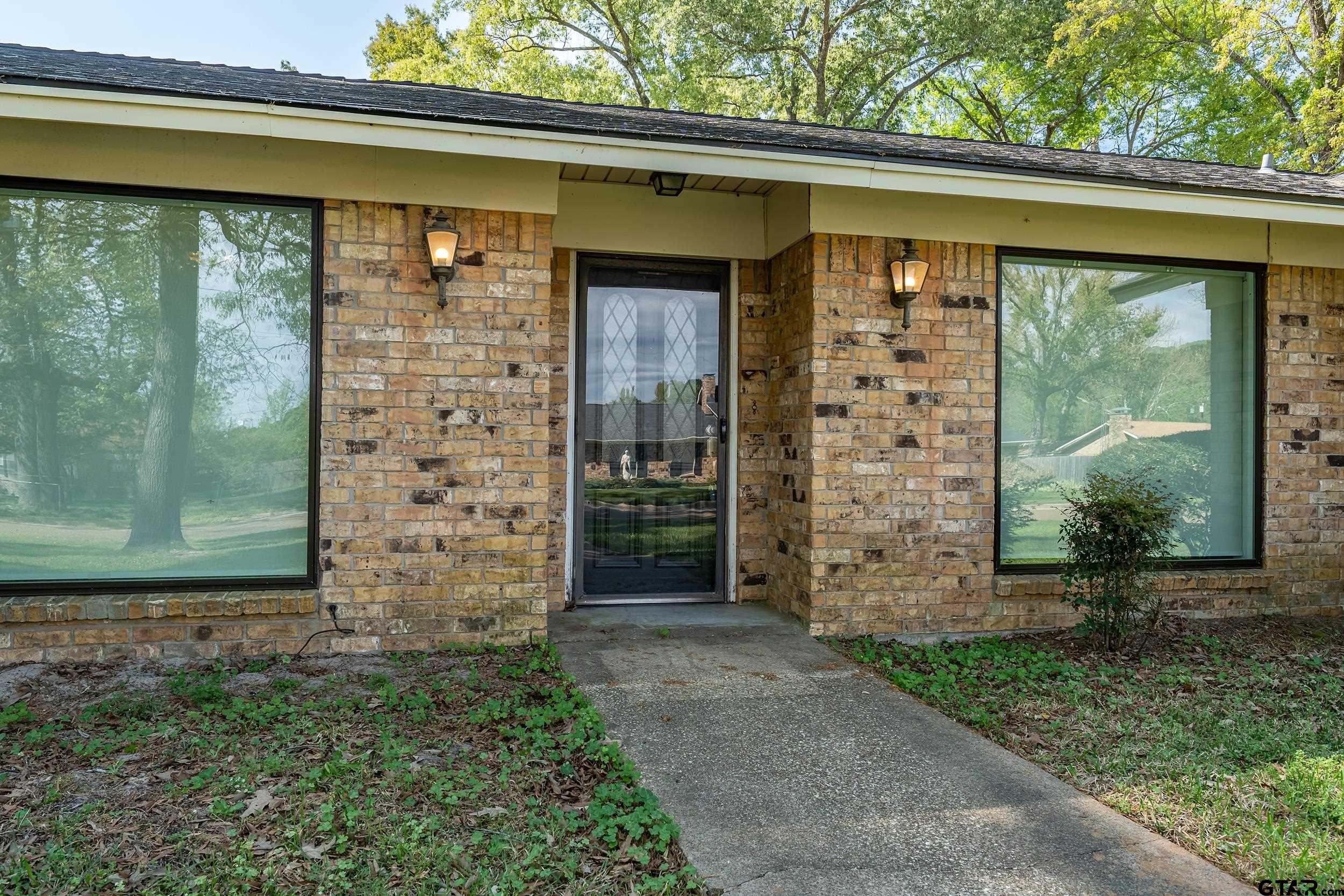 150 Rodney Hawkins, TX 75765 - Photo 3 of 36 a front view of a house with a garden