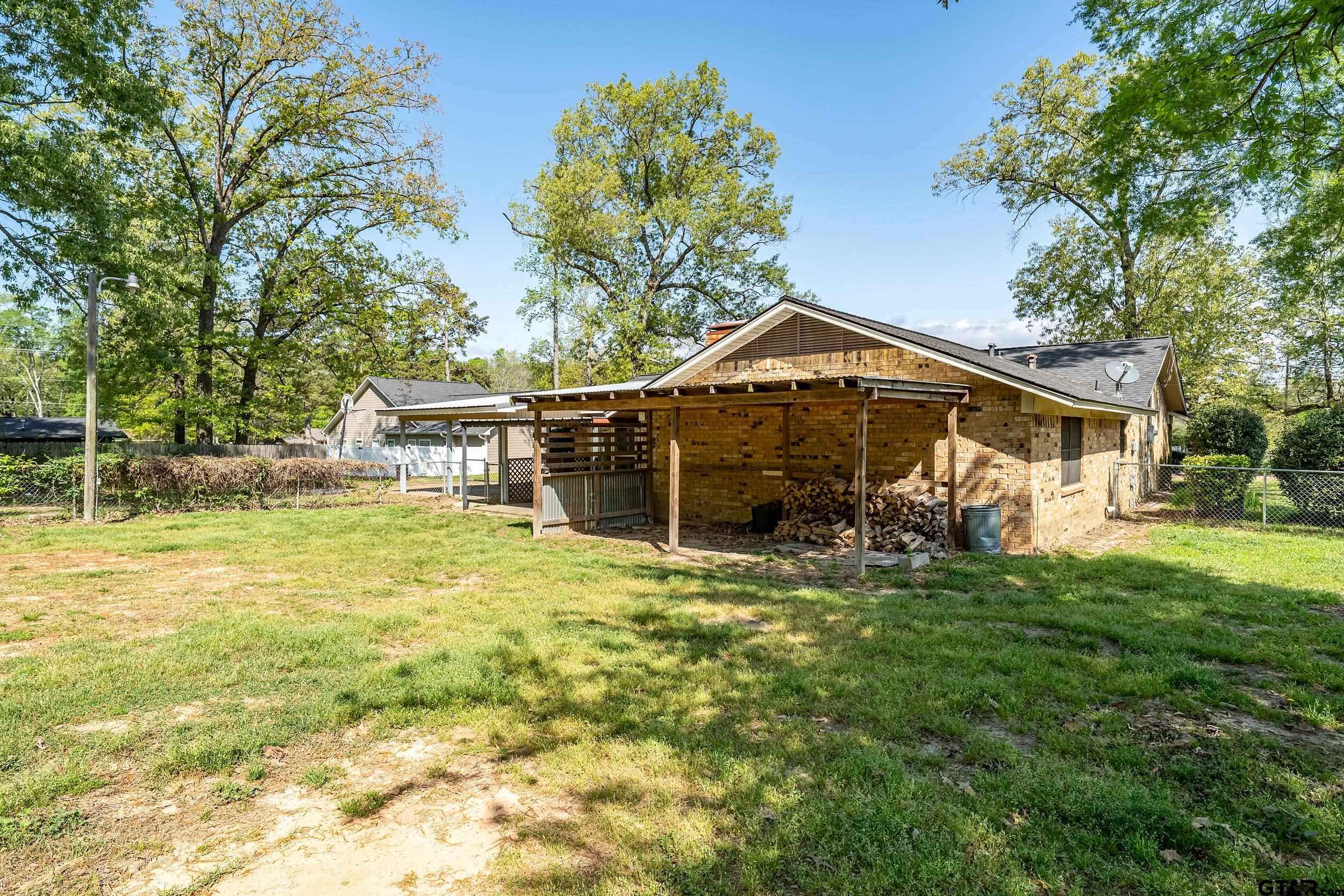 150 Rodney Hawkins, TX 75765 - Photo 33 of 36 a front view of a house with a yard