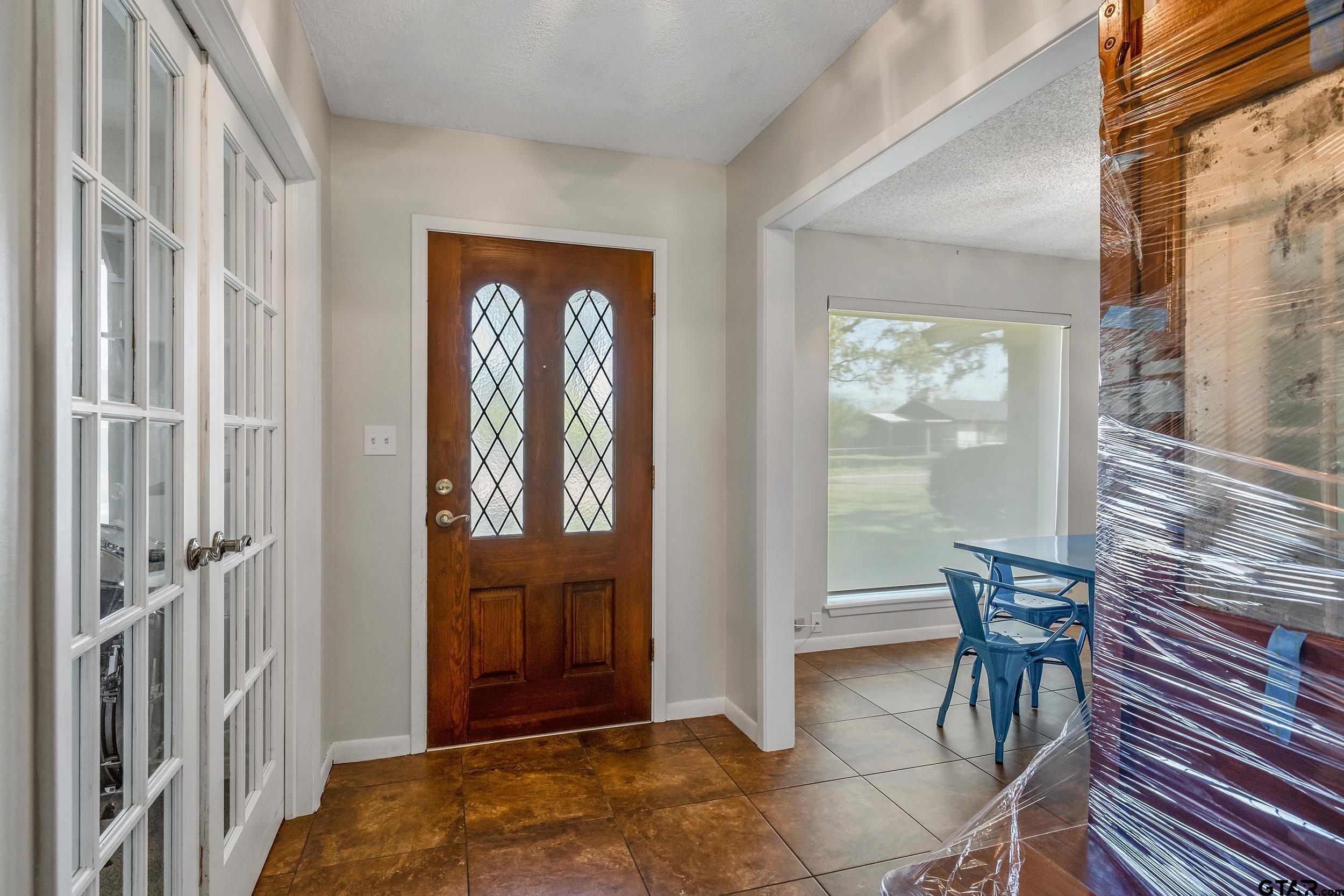 150 Rodney Hawkins, TX 75765 - Photo 4 of 36 a view of a hallway with furniture and windows