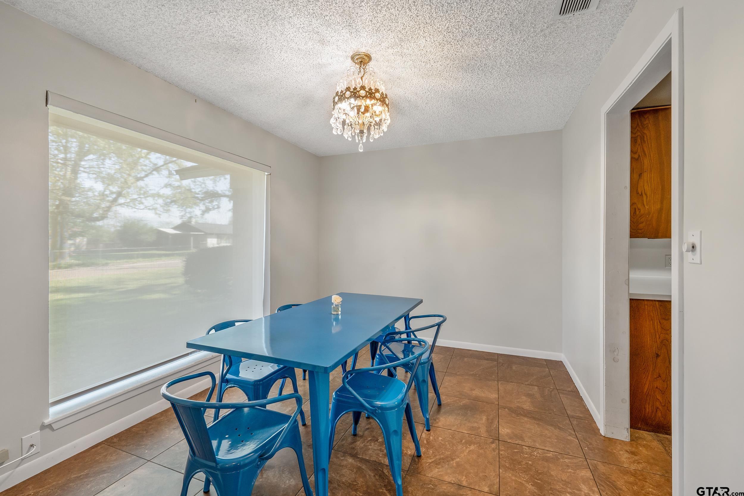 150 Rodney Hawkins, TX 75765 - Photo 5 of 36 a view of a dining room with furniture a chandelier and wooden floor