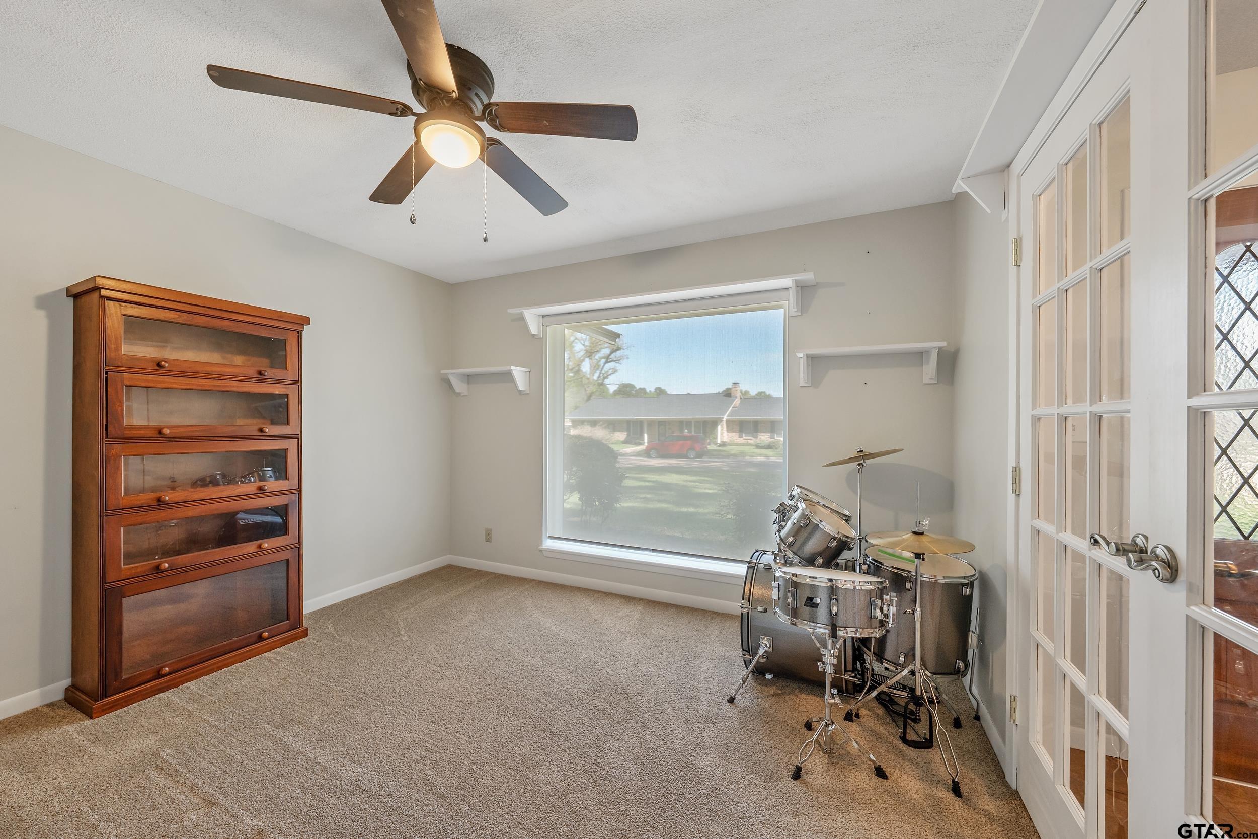150 Rodney Hawkins, TX 75765 - Photo 9 of 36 wooden floor in an empty room with a window