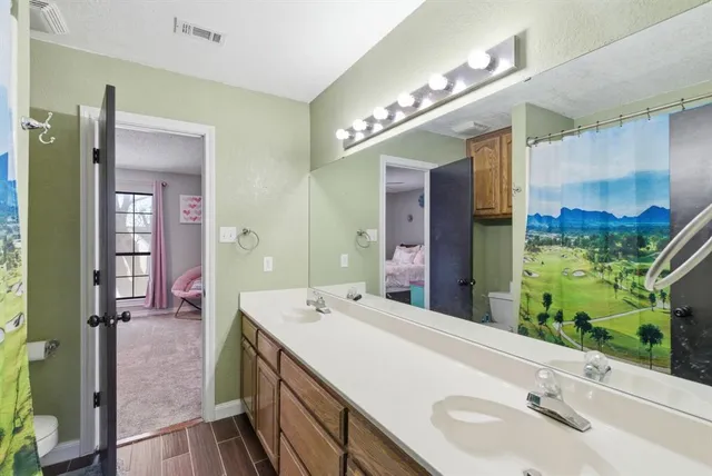 a bathroom with a sink and a large mirror