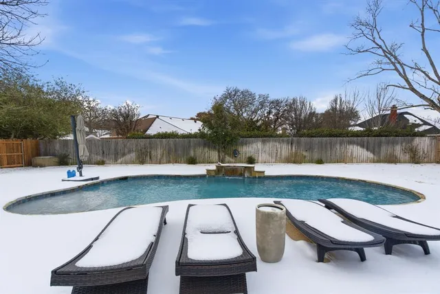 a view of a backyard with sitting area