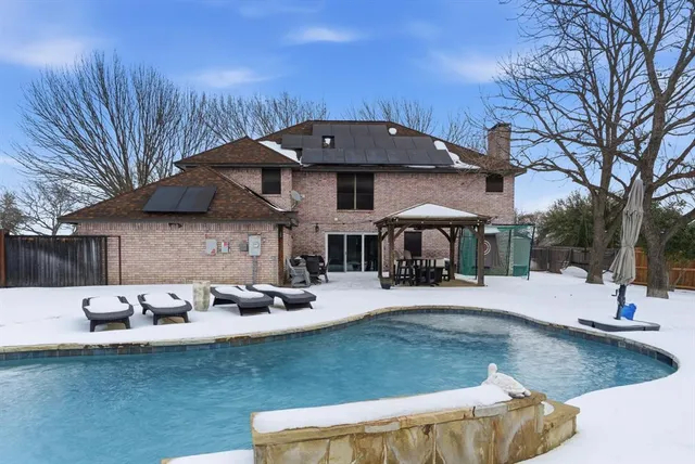 a view of a patio with swimming pool