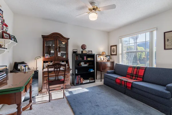 a view of a backyard with sitting area and furniture