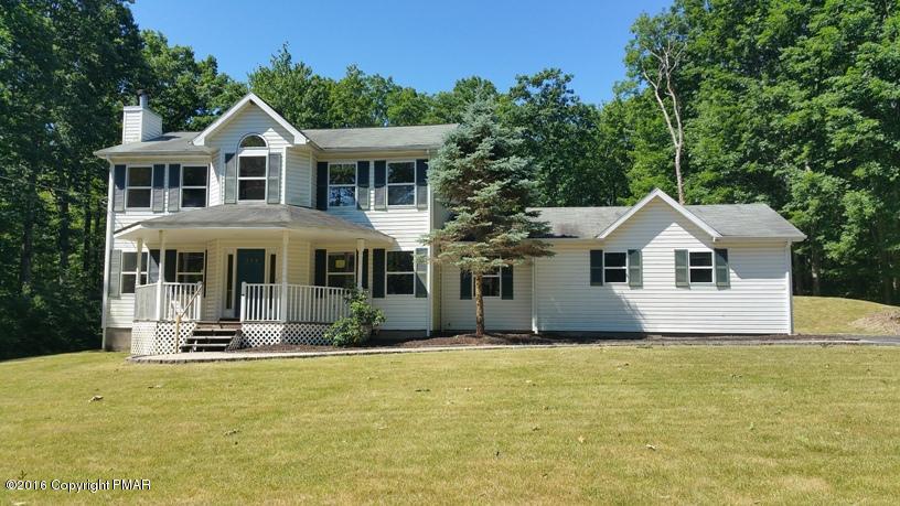 175 Devils Hole Road Cresco, PA 18326 - Photo 1 of 21 a front view of a house with a yard