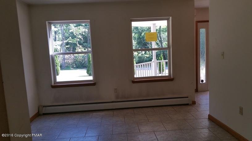 175 Devils Hole Road Cresco, PA 18326 - Photo 8 of 21 a view of a livingroom with an empty space and window
