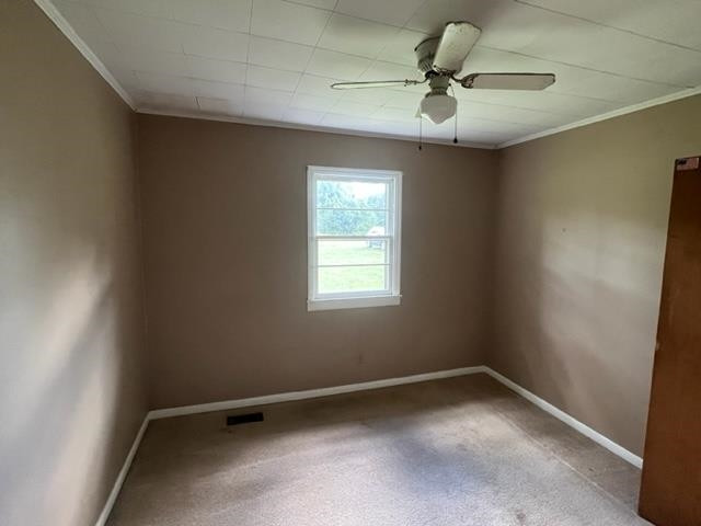10129 Boyce Road Creedmoor, NC 27522 - Photo 9 of 12 an empty room with a window and a fan
