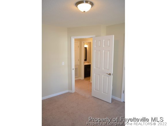 966 Rim Road Fayetteville, NC 28314 - Photo 15 of 18 a view of a room with a hallway