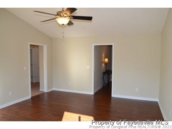 966 Rim Road Fayetteville, NC 28314 - Photo 3 of 18 a view of an empty room with wooden floor