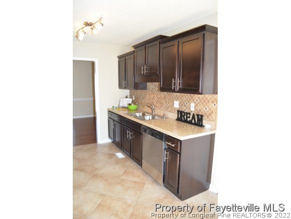 966 Rim Road Fayetteville, NC 28314 - Photo 5 of 18 a kitchen with a stove and a sink