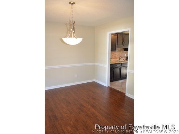 966 Rim Road Fayetteville, NC 28314 - Photo 9 of 18 a view of a kitchen from the hallway