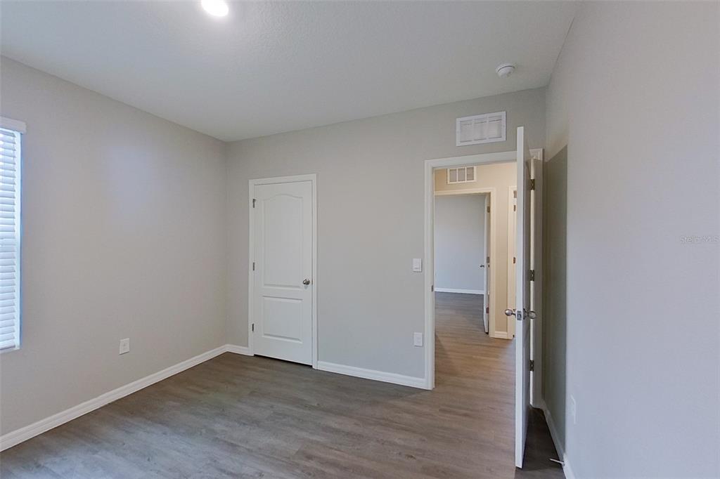 32037 Katelin Circle Leesburg, FL 34748 - Photo 18 of 20 a view of a room with wooden floor