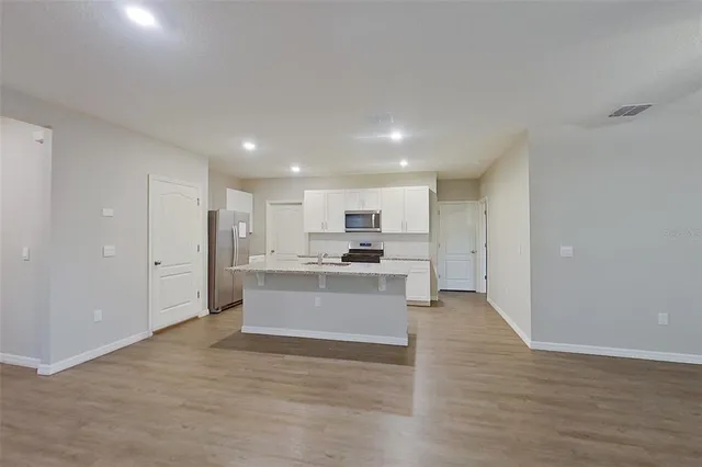 a view of kitchen with wooden floor