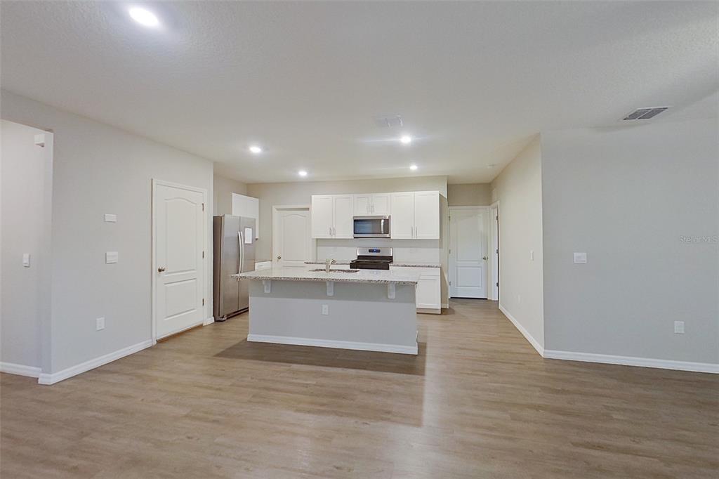 32037 Katelin Circle Leesburg, FL 34748 - Photo 3 of 20 a view of kitchen with wooden floor