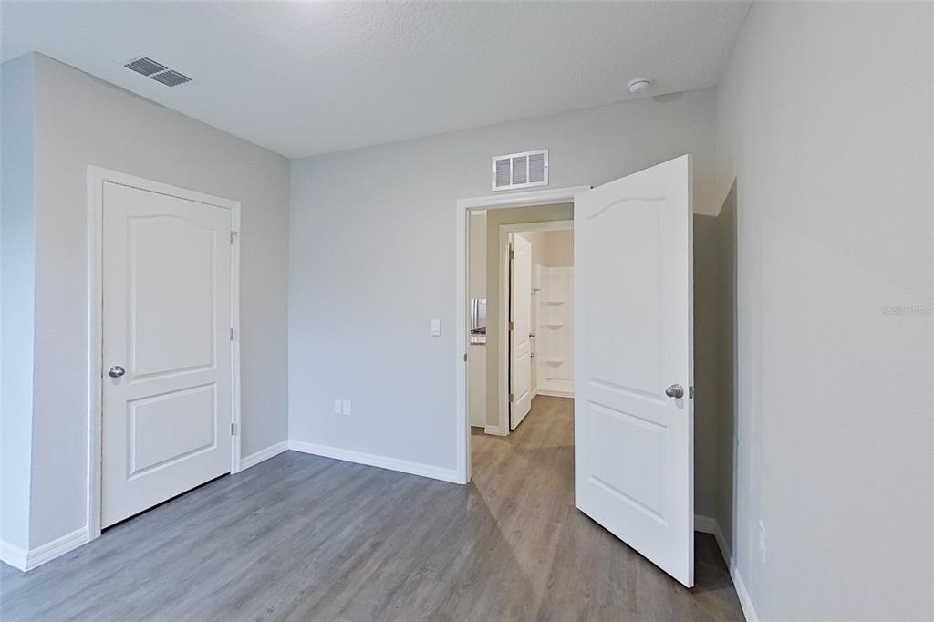 32037 Katelin Circle Leesburg, FL 34748 - Photo 8 of 20 a view of a room with wooden floor