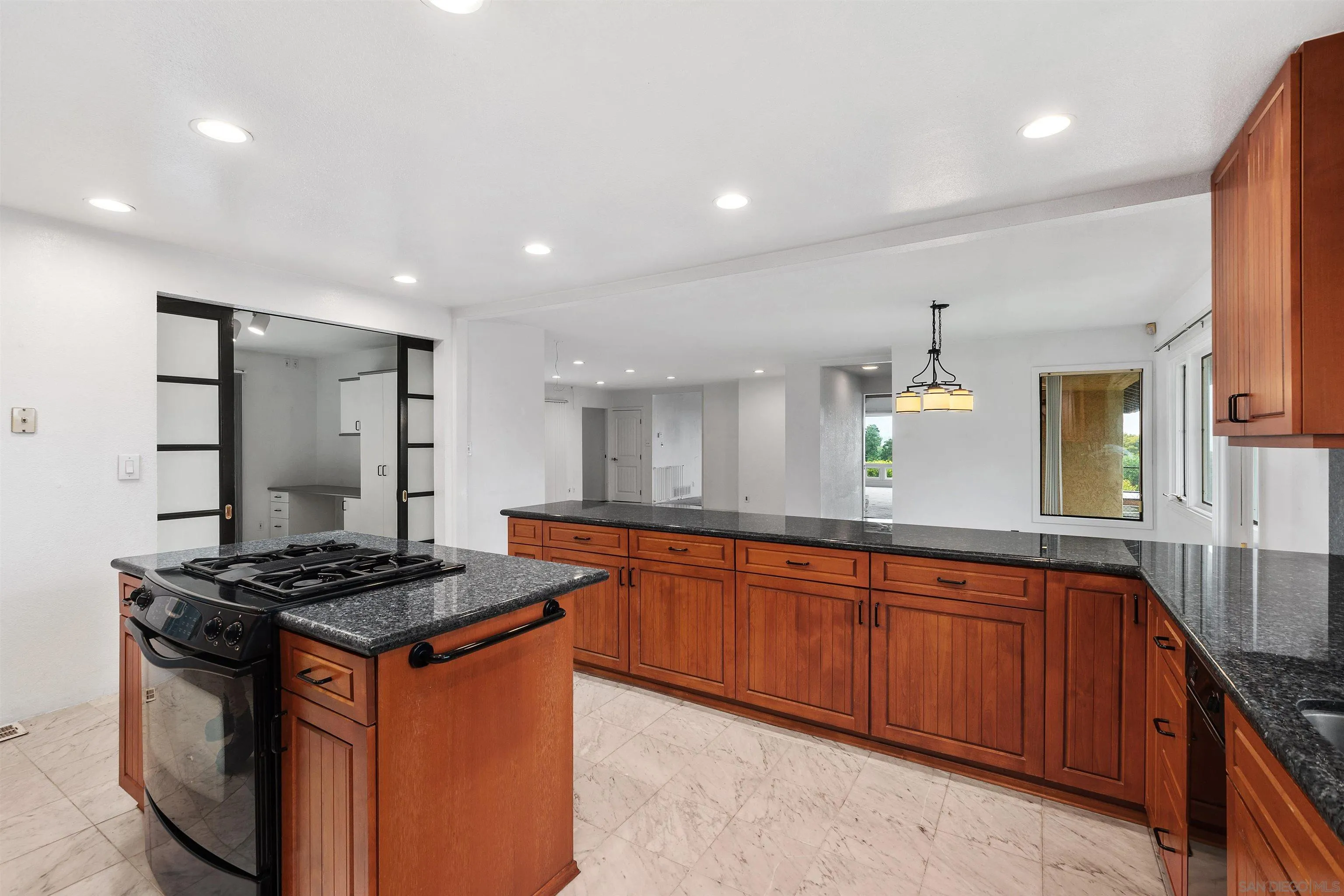 2435 Paseo Dorado La Jolla, CA 92037 - Photo 17 of 40 a kitchen with stainless steel appliances granite countertop a stove a sink and a refrigerator