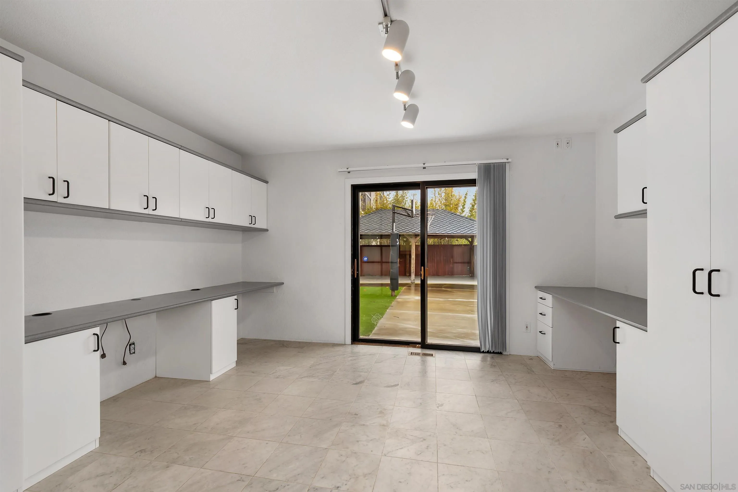 2435 Paseo Dorado La Jolla, CA 92037 - Photo 18 of 40 wooden floor in an empty room with a kitchen
