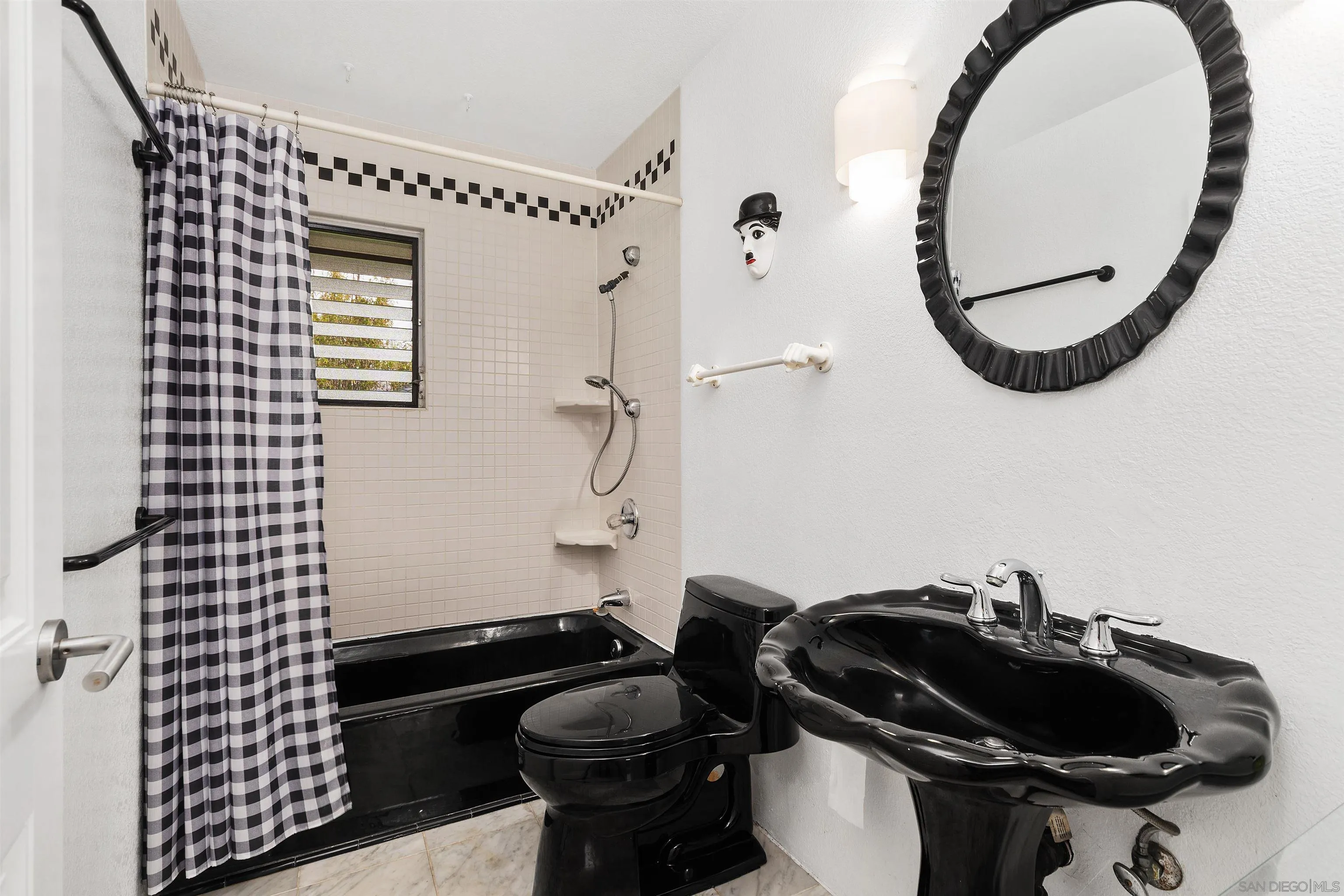 2435 Paseo Dorado La Jolla, CA 92037 - Photo 20 of 40 a bathroom with a sink a toilet and a mirror