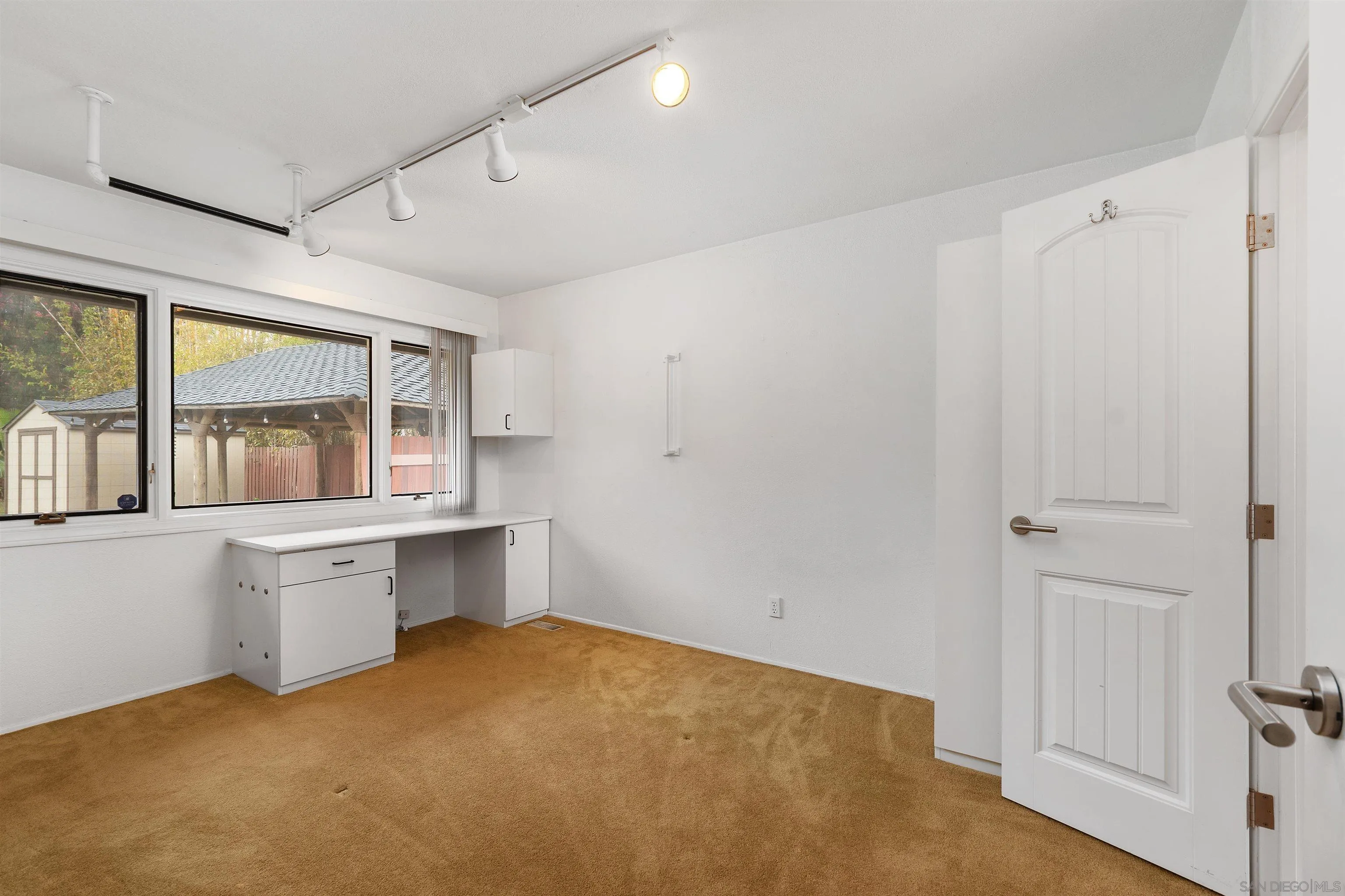 2435 Paseo Dorado La Jolla, CA 92037 - Photo 23 of 40 a room with window and cabinets