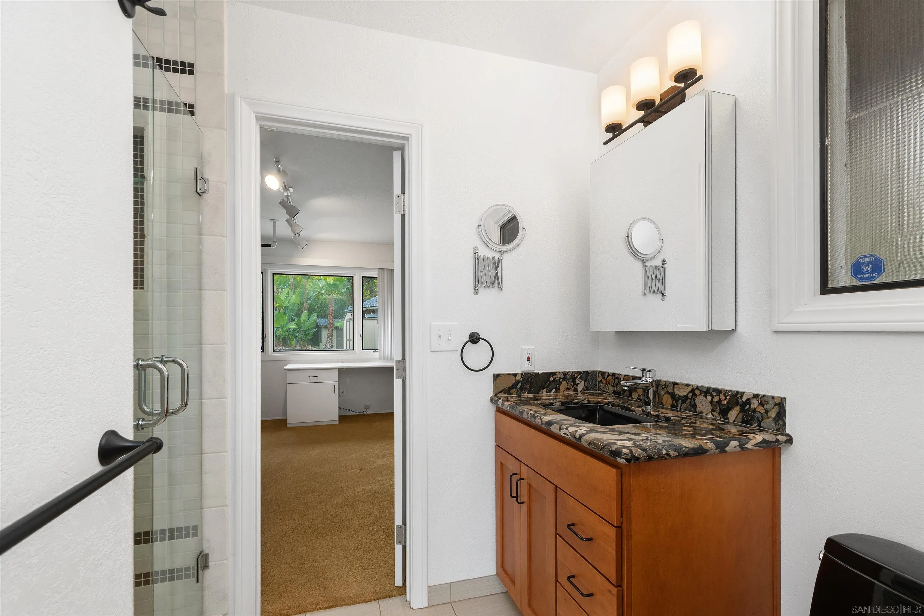 2435 Paseo Dorado La Jolla, CA 92037 - Photo 25 of 40 a kitchen with a refrigerator a stove a sink and a window