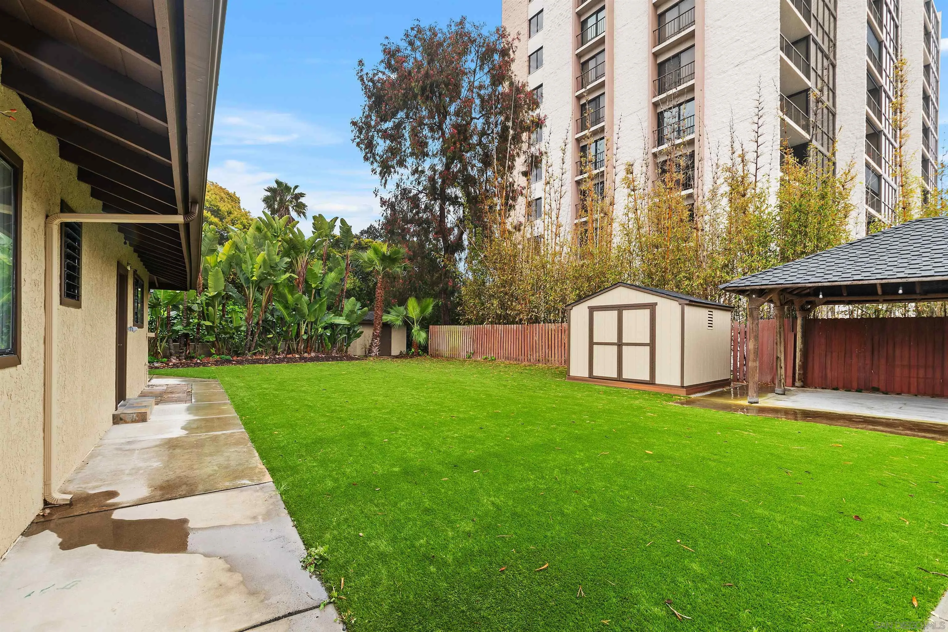 2435 Paseo Dorado La Jolla, CA 92037 - Photo 29 of 40 a front view of a house with a yard and garage