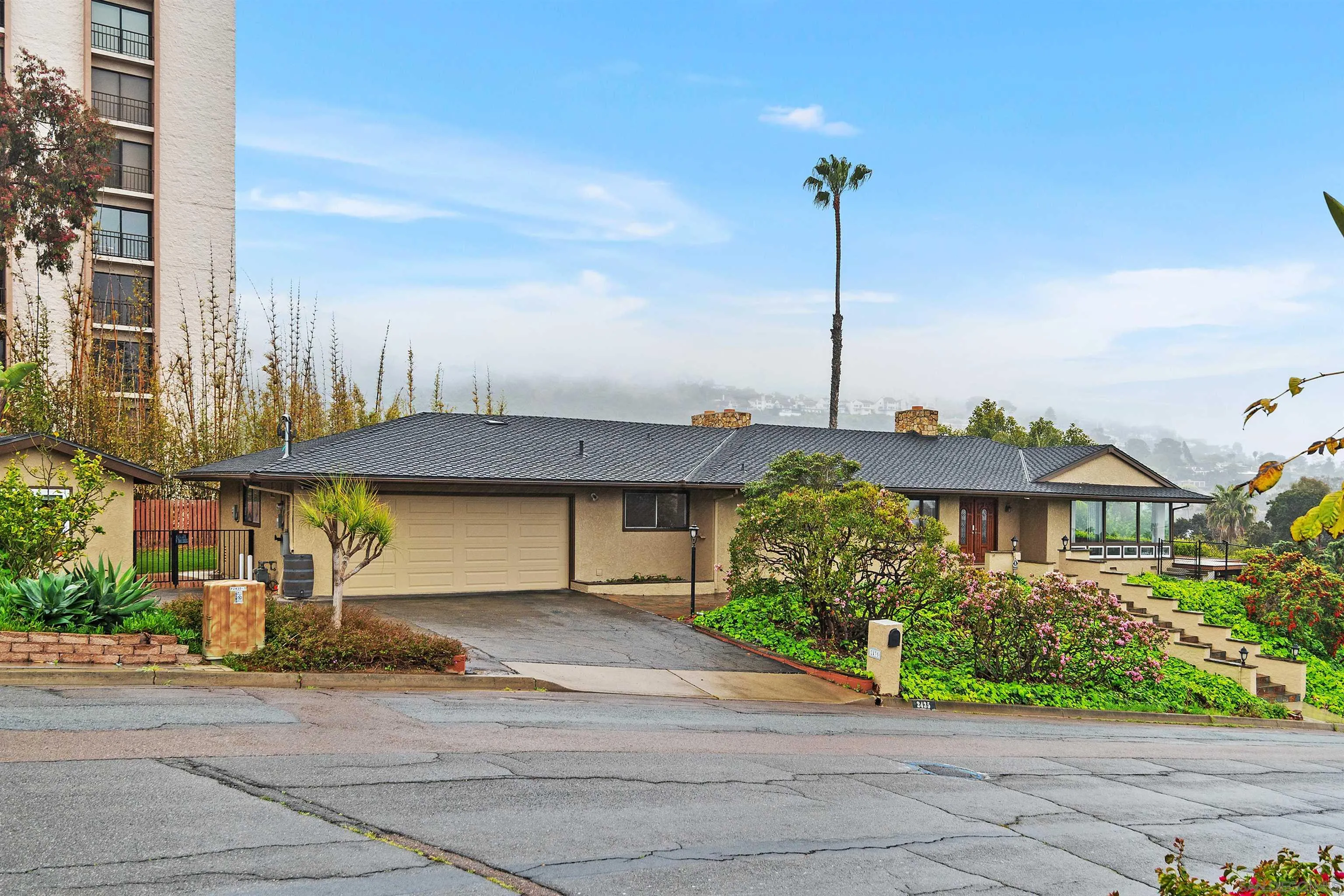 2435 Paseo Dorado La Jolla, CA 92037 - Photo 7 of 40 a front view of a house with a garden