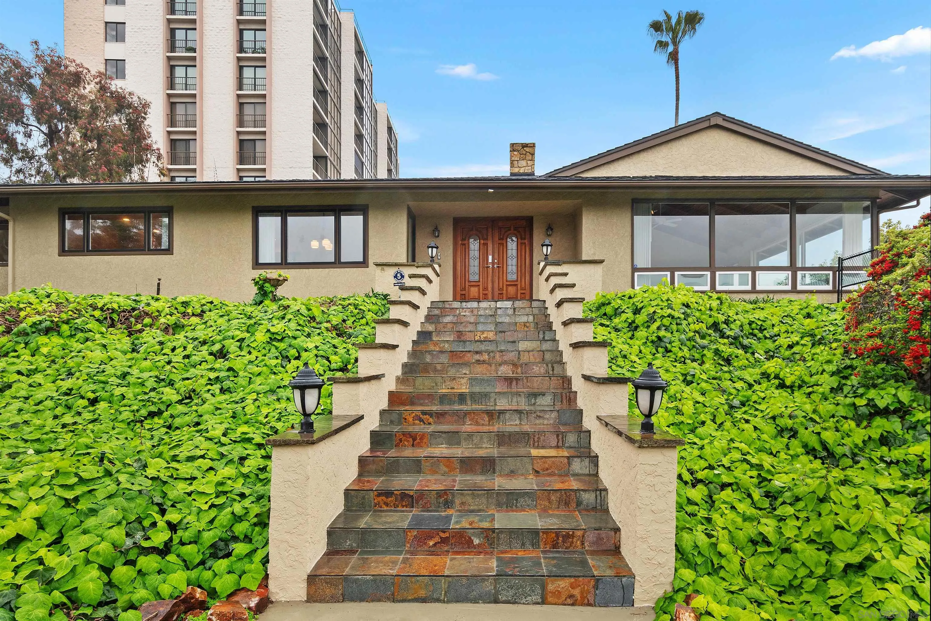 2435 Paseo Dorado La Jolla, CA 92037 - Photo 9 of 40 a front view of a house with a yard