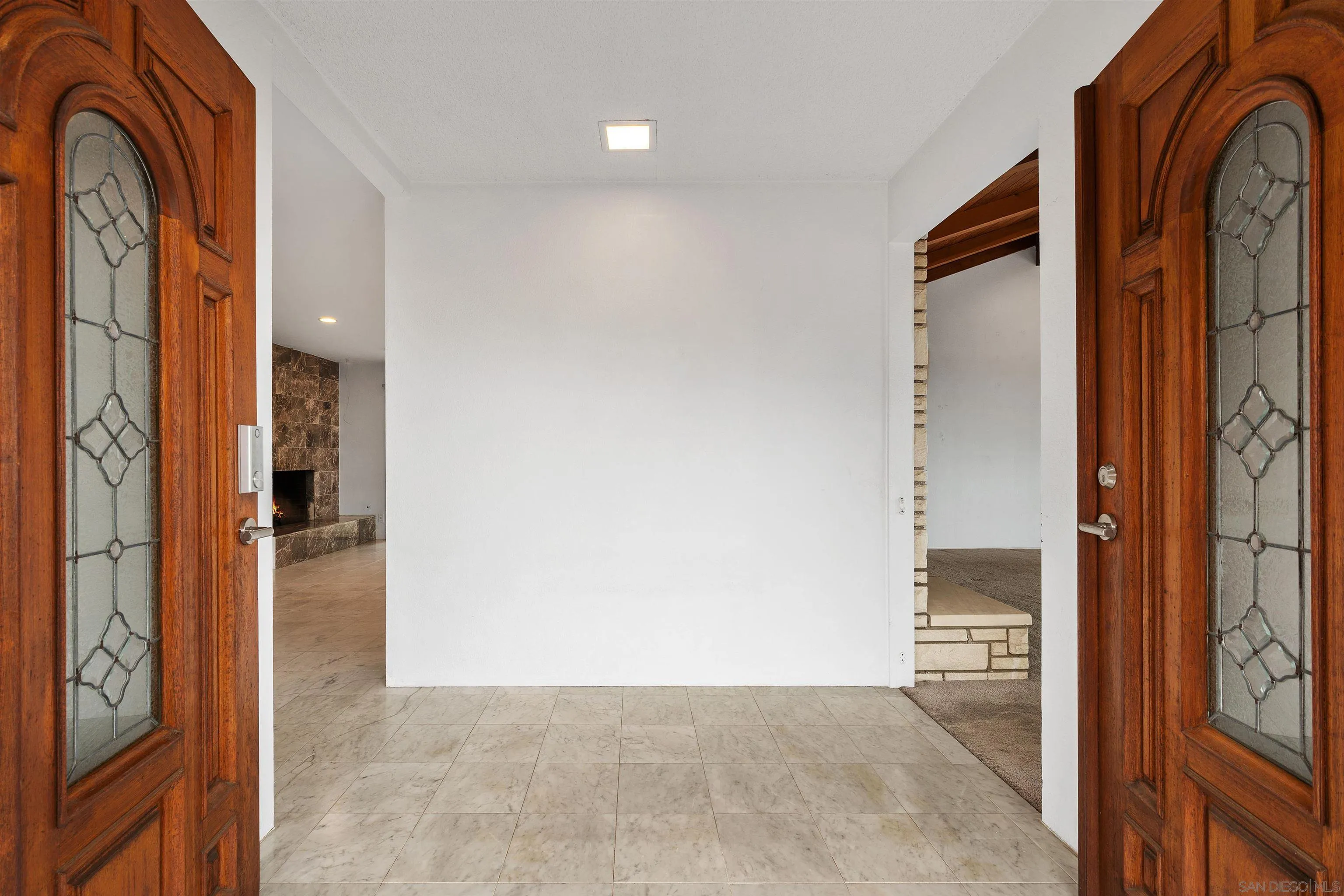2435 Paseo Dorado La Jolla, CA 92037 - Photo 10 of 40 a view of a hallway with wooden floor and entryway