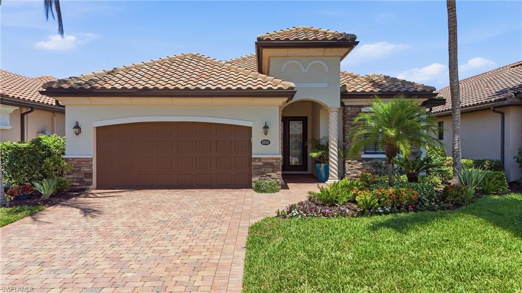 3058 Aviamar Circle Naples, FL 34114 - Photo 1 of 50 Mediterranean-inspired exterior featuring a barrel tile roof and stucco siding