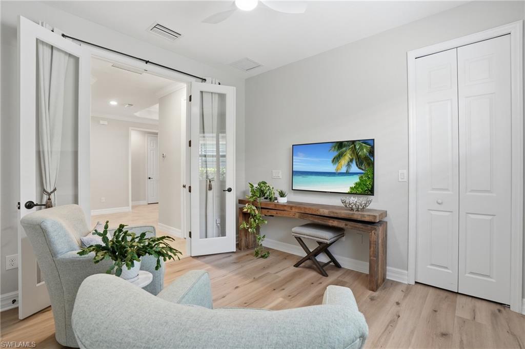3058 Aviamar Circle Naples, FL 34114 - Photo 16 of 50 Light wood-finish flooring complements the neutral wall tones