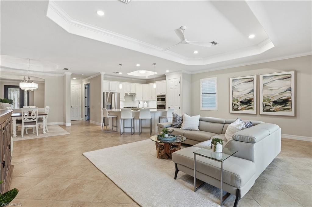3058 Aviamar Circle Naples, FL 34114 - Photo 2 of 50 Open concept living space featuring neutral wall tones and tile flooring